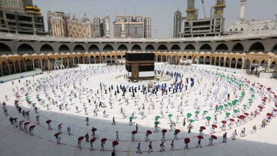 TOPSHOT - Muslim pilgrims perform the final walk around the Kaaba (Tawaf al-Wadaa), Islam's holiest shrine, at the Grand Mosque in Saudi Arabia's holy city of Mecca on August 13, 2019. - Muslims from across the world gather in Mecca in Saudi Arabia for the annual six-day pilgrimage, one of the five pillars of Islam, an act all Muslims must perform at least once in their lifetime if they have the means to travel to Saudi Arabia. (Photo by Abdel Ghani BASHIR / AFP) (Photo by ABDEL GHANI BASHIR/AFP via Getty Images)