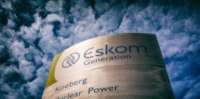 A sign at the entrance to Koeberg nuclear power station, operated by Eskom Holdings SOC Ltd., in Cape Town, South Africa, on Wednesday, Nov. 25, 2020. The decision to begin installing new steam generators at the Koeberg plant near Cape Town underscores state-owned Eskoms confidence that it will win approval to prolong production of low-emissions nuclear power into the middle of the century. Photographer: Dwayne Senior/Bloomberg via Getty Images