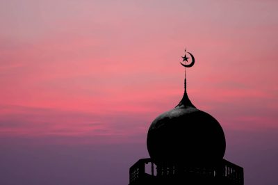 sithouette of masjid dome (mosque) on red sky background