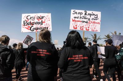 Protesters hold signs as they take part in a march against gender based violence and in solidarity with women who have been subject to violence and in memory of those who have been killed, at the North Beach in Durban, on September 7, 2019. - The Crime Against Women in South Africa Report released by Statistics South Africa (SA) shows that femicide is 5 times higher than the global average. President Cyril Ramaphosa will propose to cabinet that all crimes against women and children attract harsher minimum sentences. (Photo by Rajesh JANTILAL / AFP)        (Photo credit should read RAJESH JANTILAL/AFP/Getty Images)